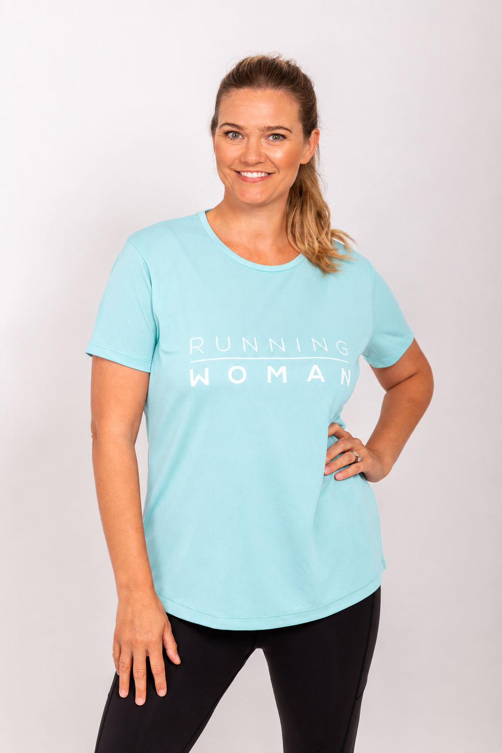 Mint Running Woman running T-shirt on a model with one hand on her hip