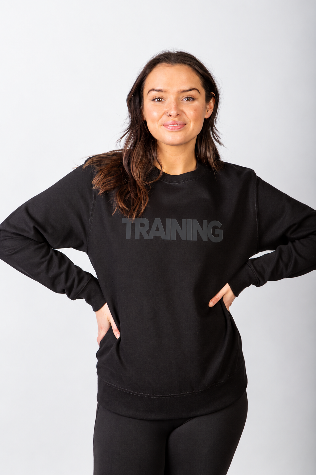 Black Run Club TRAINING sweatshirt on a brunette model with hands on hips
