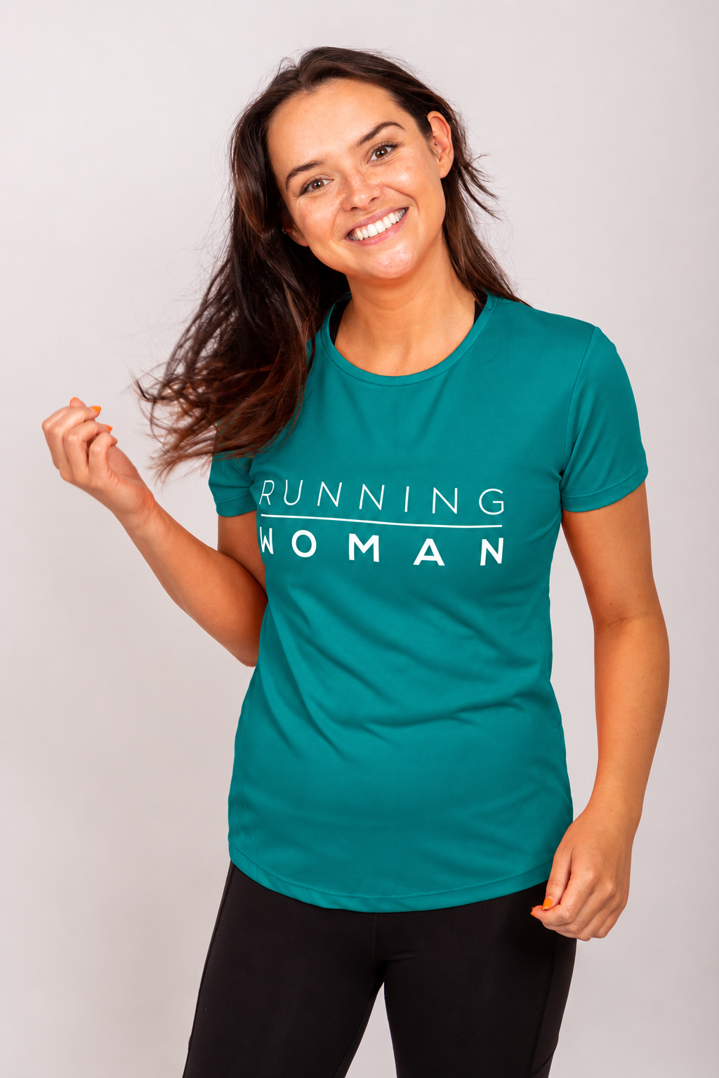 Jade Running Woman running T-shirt on a smiling model with her head tilted