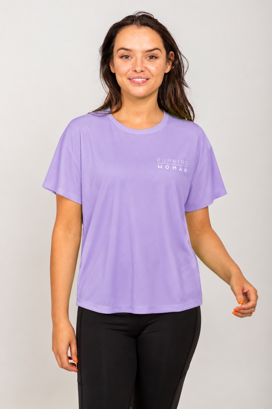 Lavender open-back Running Woman T-shirt on a brunette model facing forward in a relaxed pose