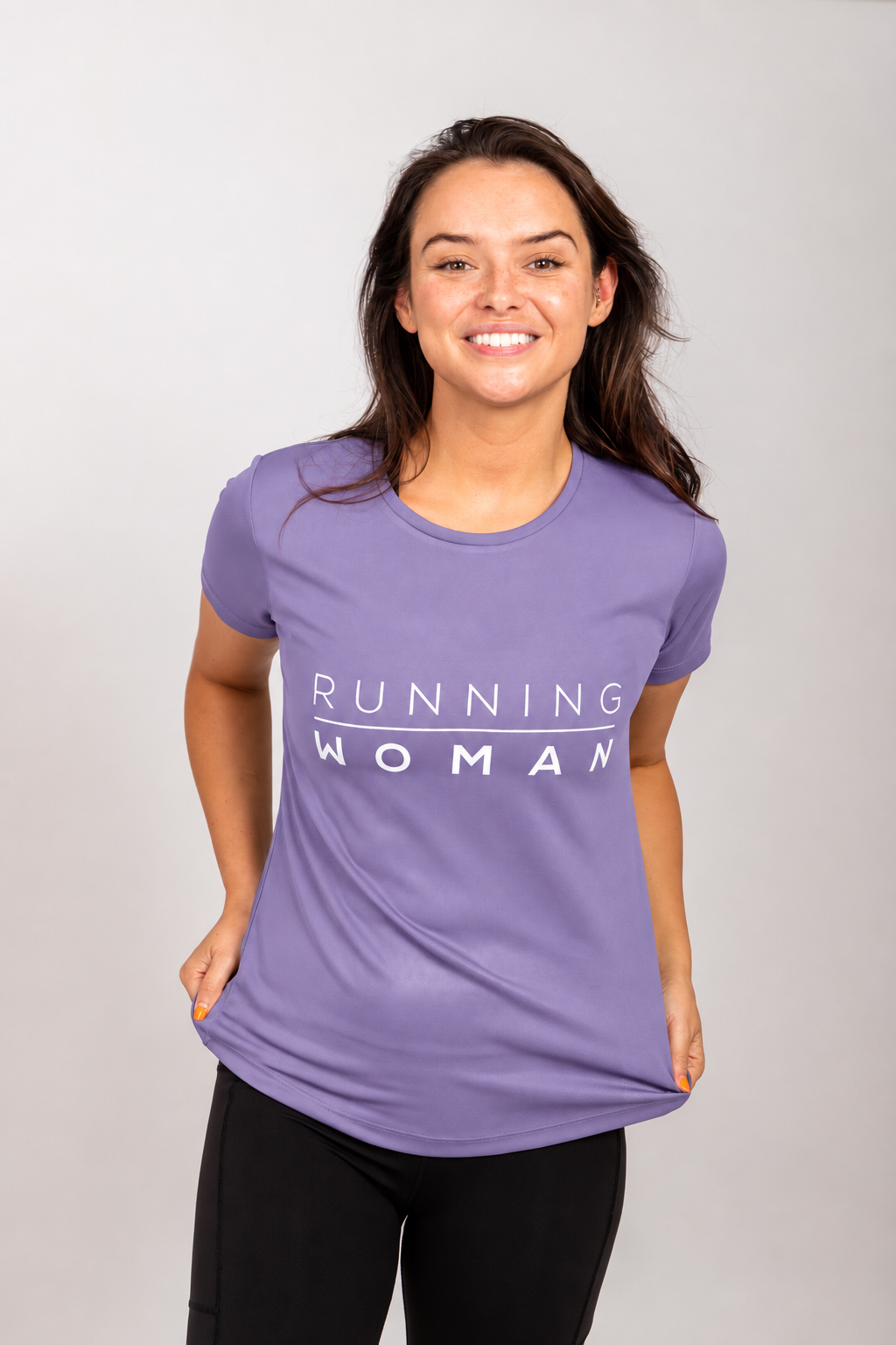 Front view of the lavender Running Woman running T-shirt with the model holding the hem