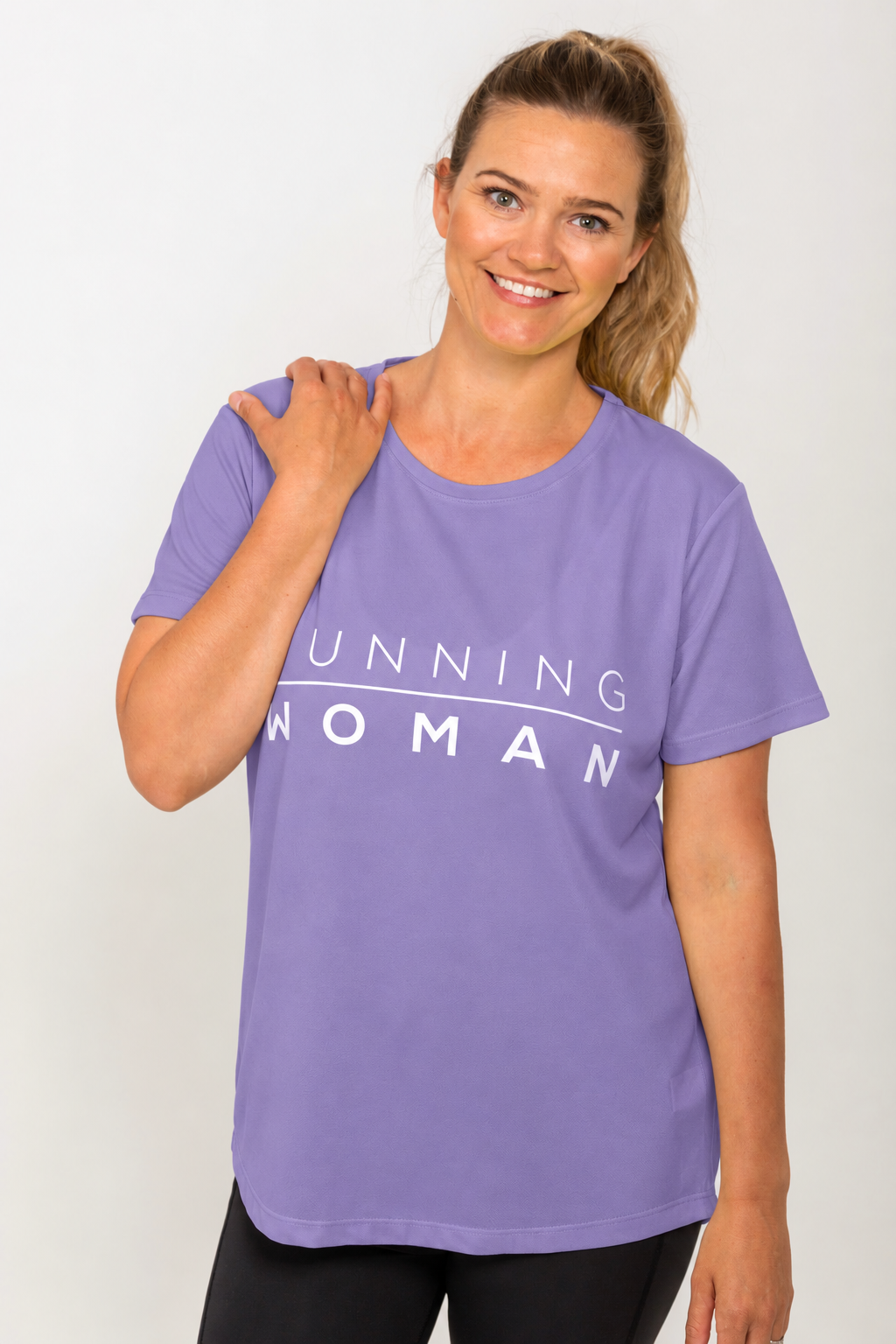 Model wearing the lavender Running Woman running T-shirt with one hand resting near her shoulder