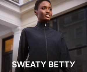 Sweaty Betty advertisement showing a woman in a black zip-up top