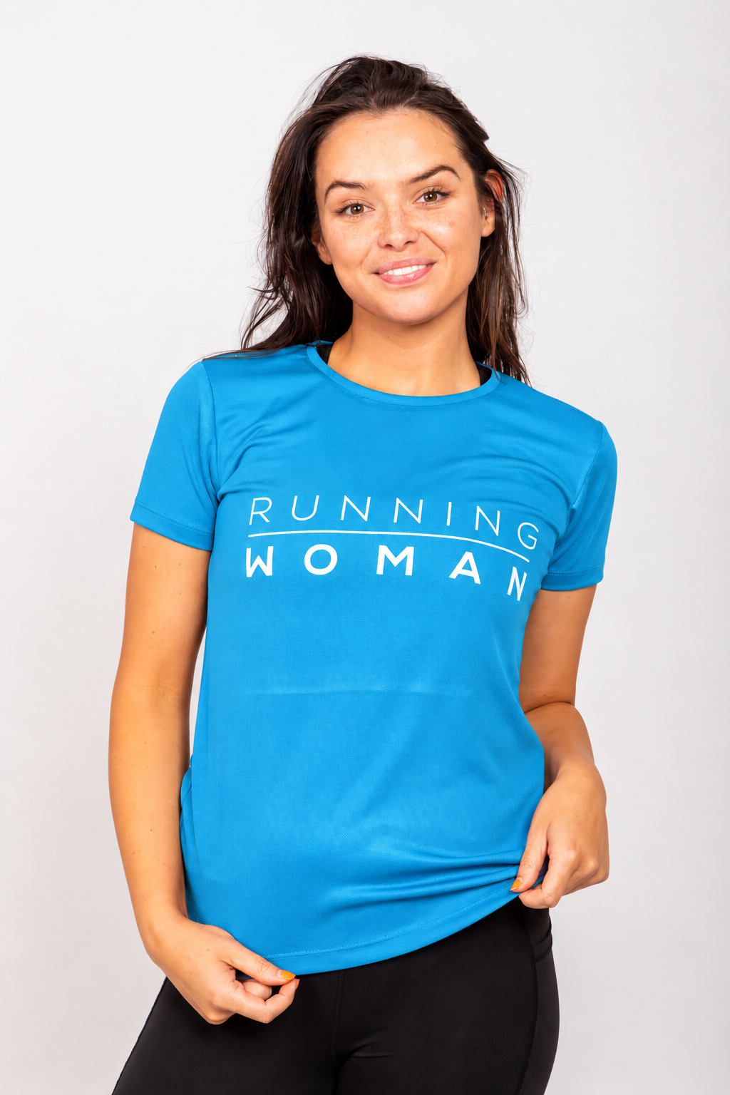 Sapphire blue Running Woman running T-shirt on a model holding the hem