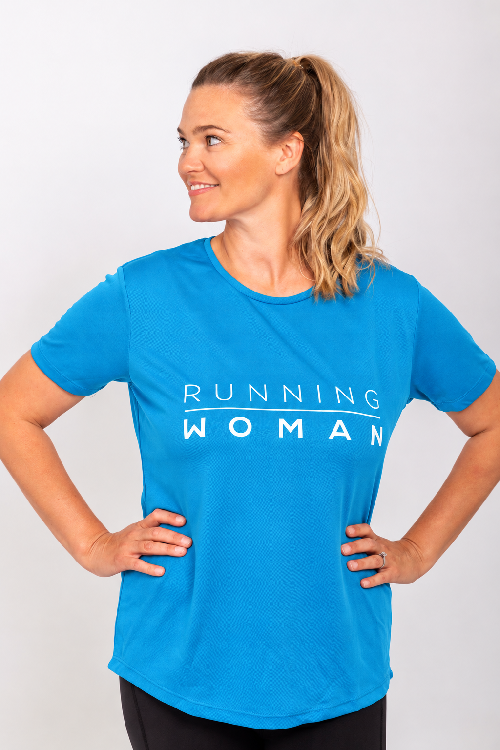 Sapphire blue Running Woman running T-shirt on a model with both hands on her hips